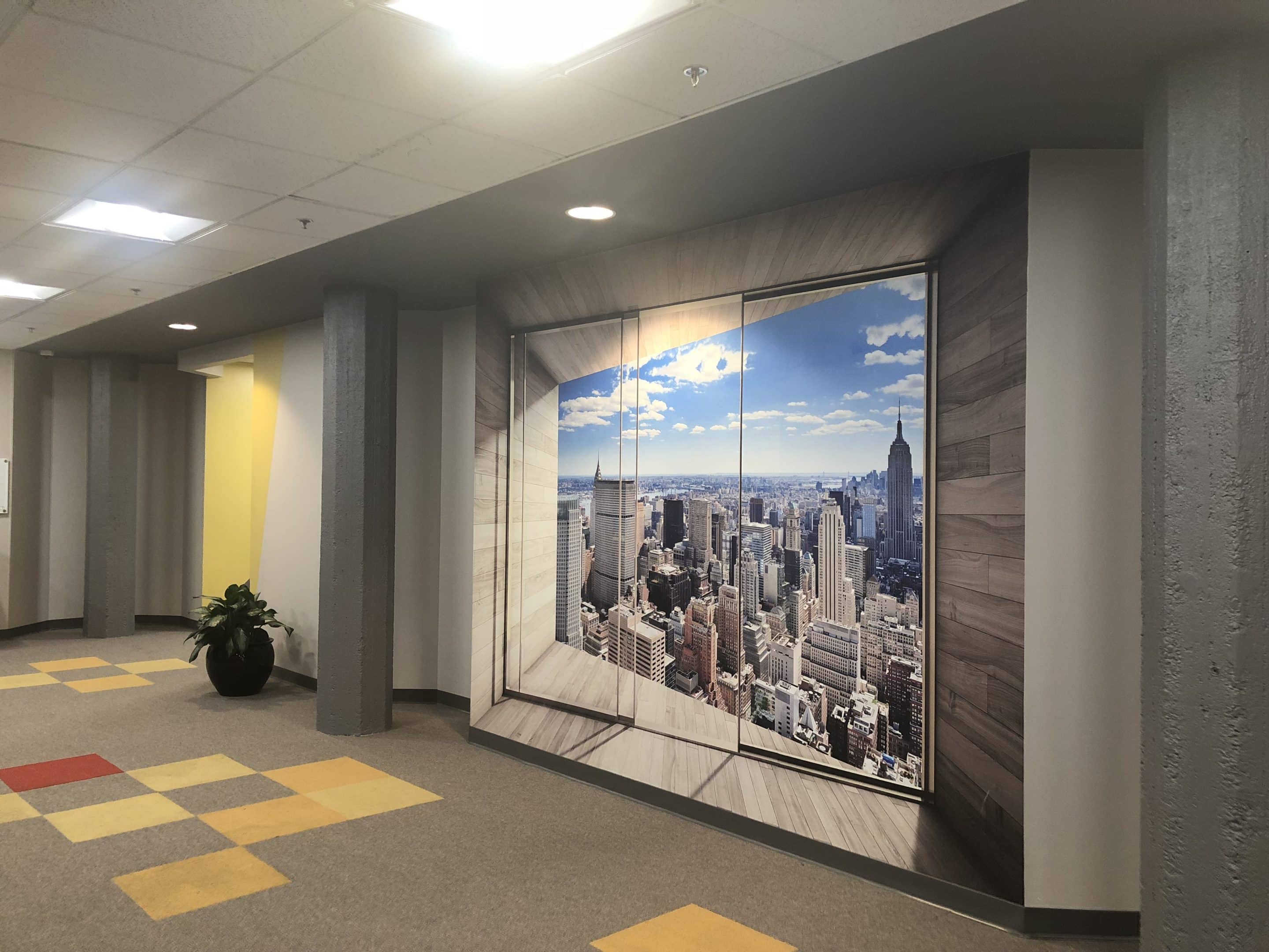 Lobby of a commercial building, featuring a minimalist design with a single plant, creating a clean and welcoming atmosphere.